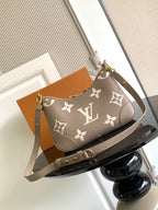 Louis Vuitton monogram crossbody bag with detachable strap and front pocket