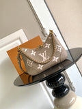 Louis Vuitton monogram shoulder bag with chain strap and floral logo pattern