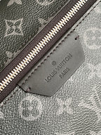 Louis Vuitton Paris leather logo patch on monogram backpack lining