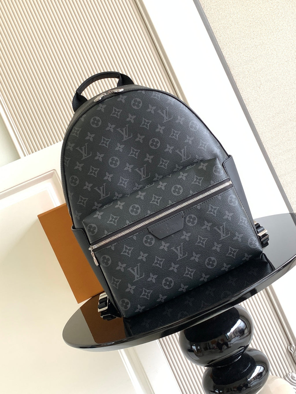Louis Vuitton monogram backpack with top handle, front zip and adjustable shoulder straps