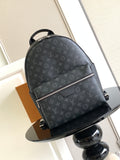 Louis Vuitton monogram backpack with top handle, front zip and adjustable shoulder straps