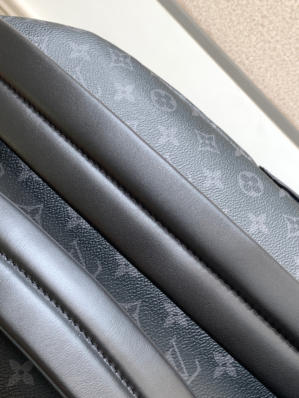 Louis Vuitton monogram backpack interior with multiple black fabric straps