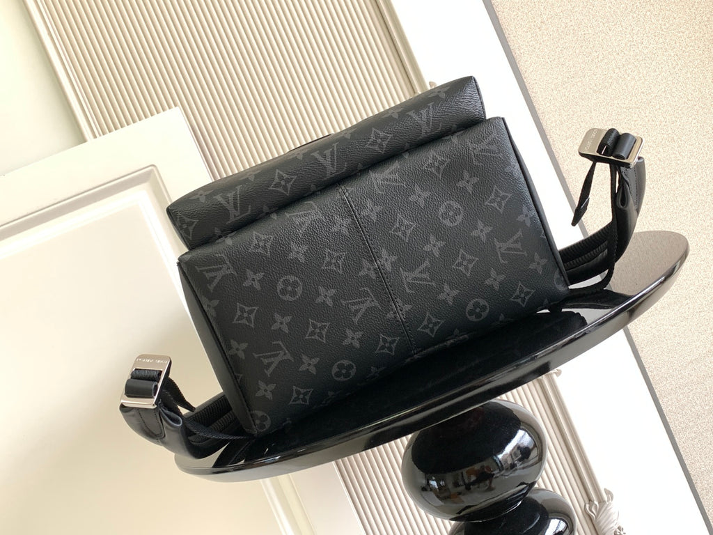Louis Vuitton monogram backpack with top flap and front hardware