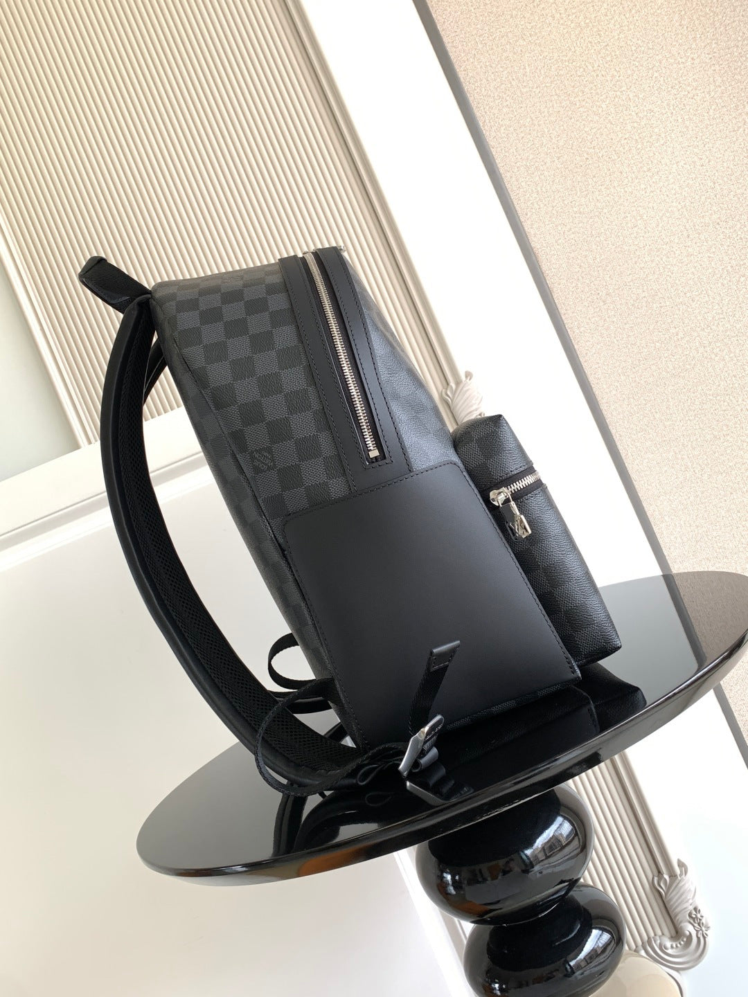 Louis Vuitton checkered backpack with wide shoulder straps, dark gray, front zip panel