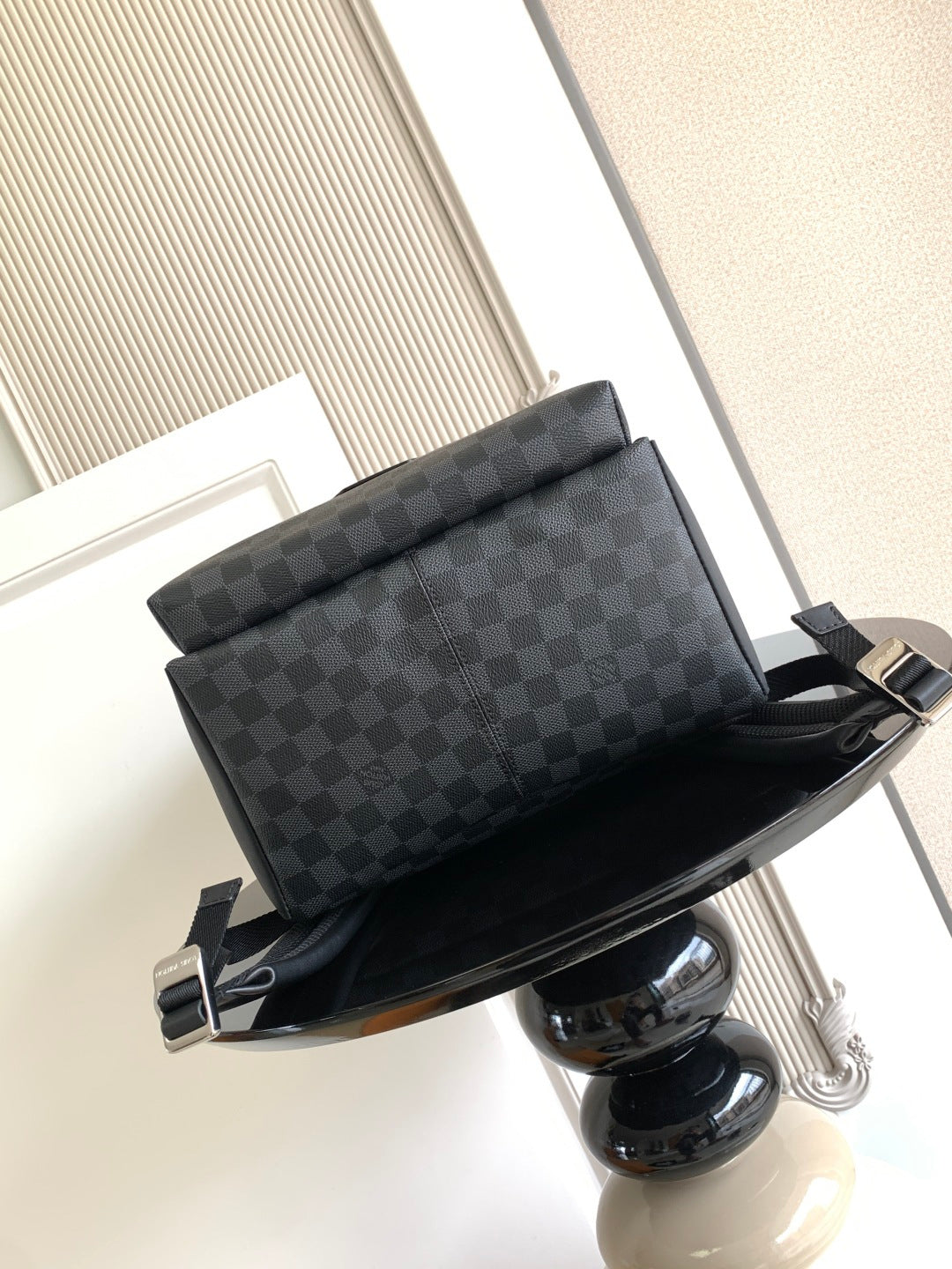 Louis Vuitton checkered pouch-style bag with top handle and shoulder strap, dark gray