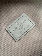 Louis Vuitton leather label with stitched border on checkered bag