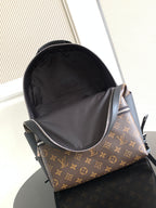Louis Vuitton monogram mini backpack open, showing black fabric interior