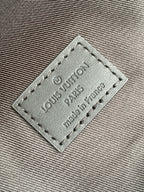 Louis Vuitton leather patch reading "Louis Vuitton" and "made in France"