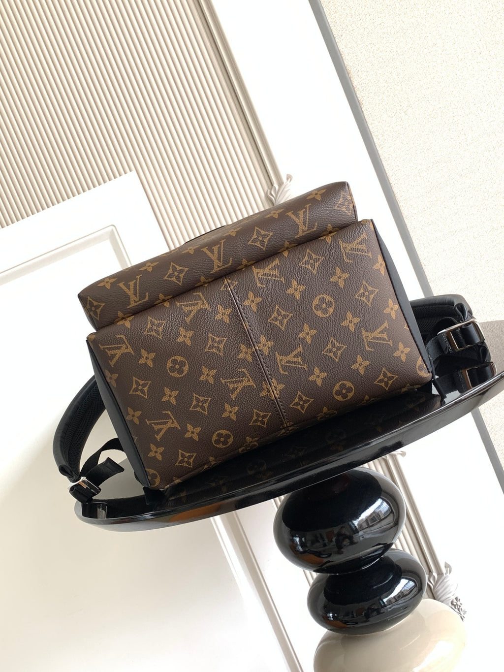 Louis Vuitton monogram backpack with top handle and zipper closure