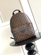 Louis Vuitton monogram backpack with front zipper and black leather trim