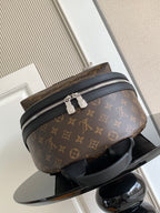 Louis Vuitton monogram mini backpack with zip top and black shoulder strap