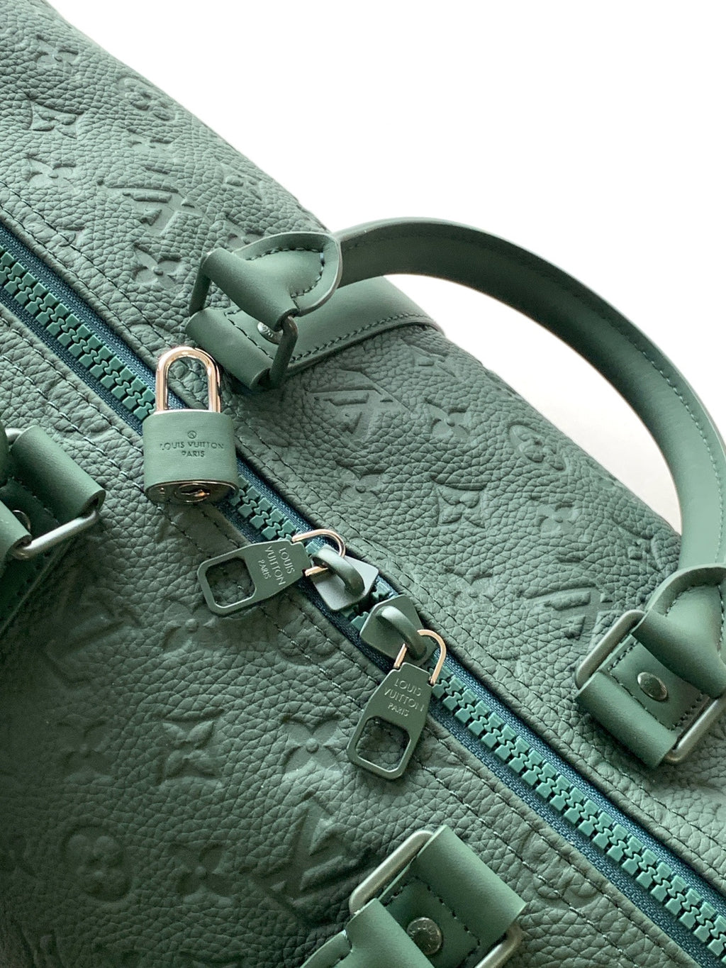 Louis Vuitton green monogram duffel bag zipper pull and hardware close-up