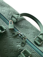 Louis Vuitton green monogram duffel bag zipper pull and hardware close-up