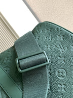Louis Vuitton green textured leather duffel bag with metal buckle detail