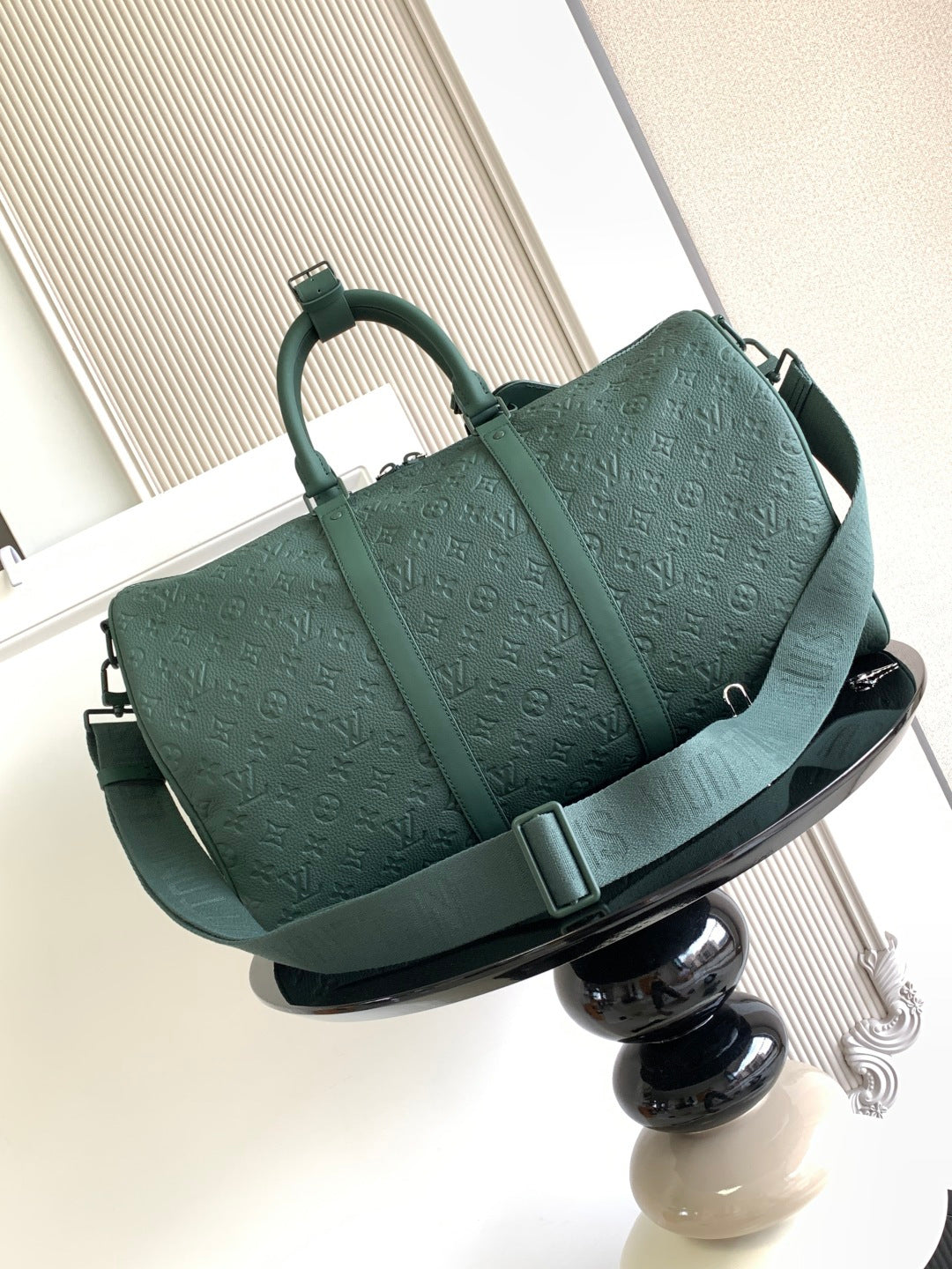 Louis Vuitton green monogram duffel bag side view with buckle strap