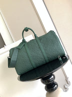 Louis Vuitton green monogram duffel bag with top handles and shoulder strap