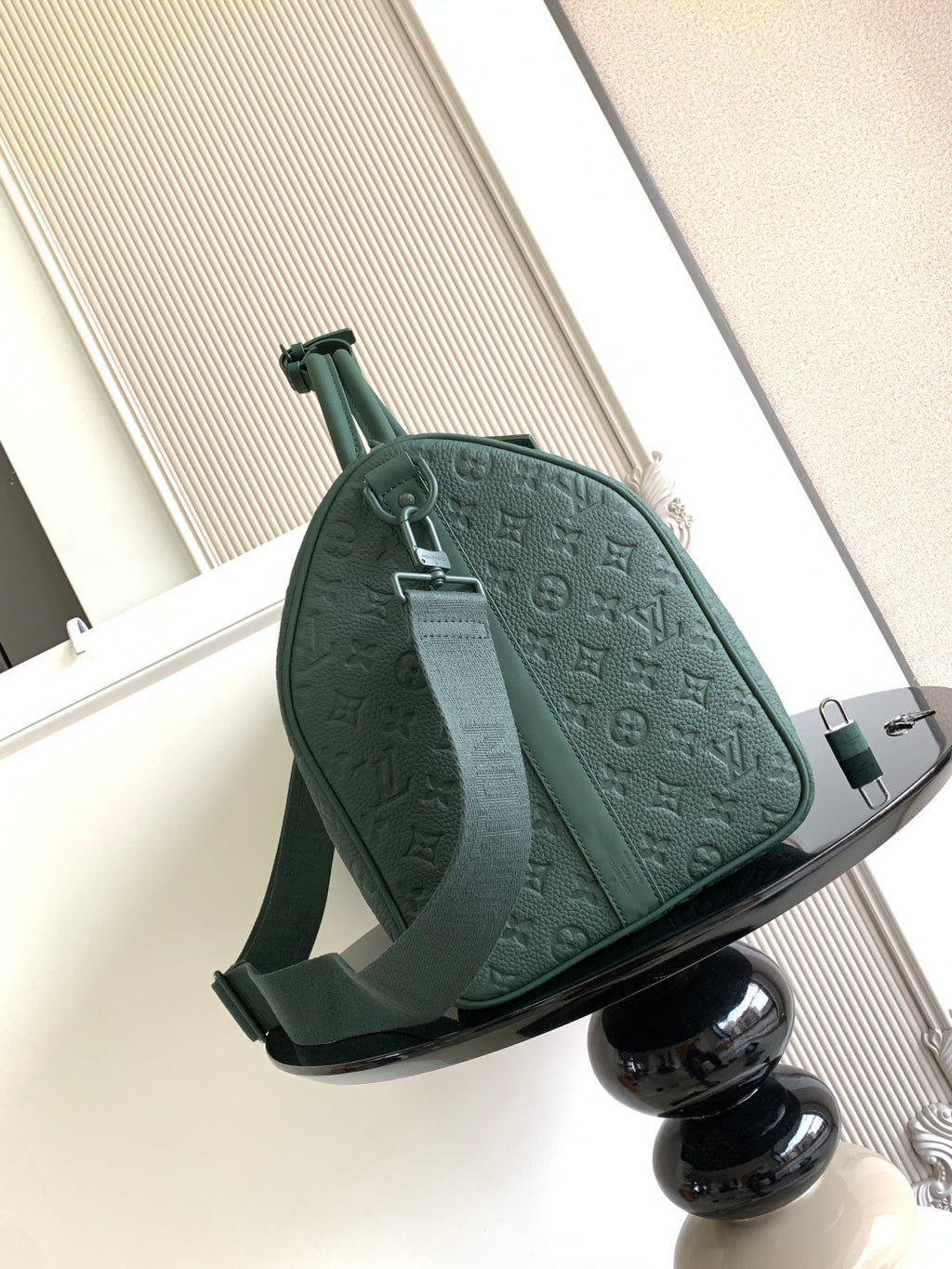Louis Vuitton green monogram duffel bag front view with adjustable shoulder strap