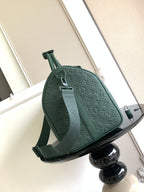 Louis Vuitton green monogram duffel bag front view with adjustable shoulder strap