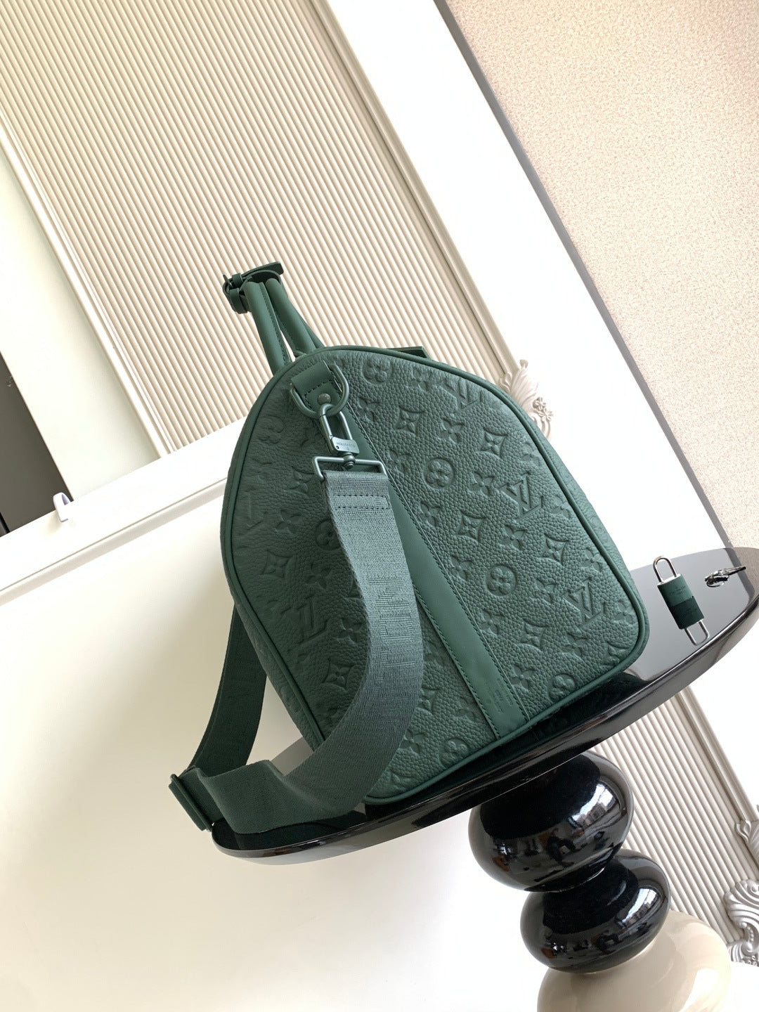 Louis Vuitton green monogram duffel bag front view with adjustable shoulder strap