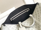 Monogram duffel bag interior with black zip pocket and light gray leather trim