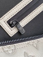 Monogram duffel bag zipper pull and track on light gray leather trim