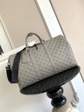 Monogram duffel bag in light gray with top handles and crossbody strap