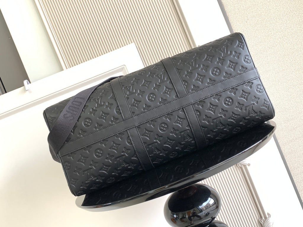 Louis Vuitton bag front view with embossed monogram pattern and crossbody strap