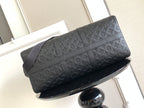 Louis Vuitton bag front view with embossed monogram pattern and crossbody strap