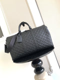 Louis Vuitton bag in dark leather with embossed monogram pattern, top handles and strap