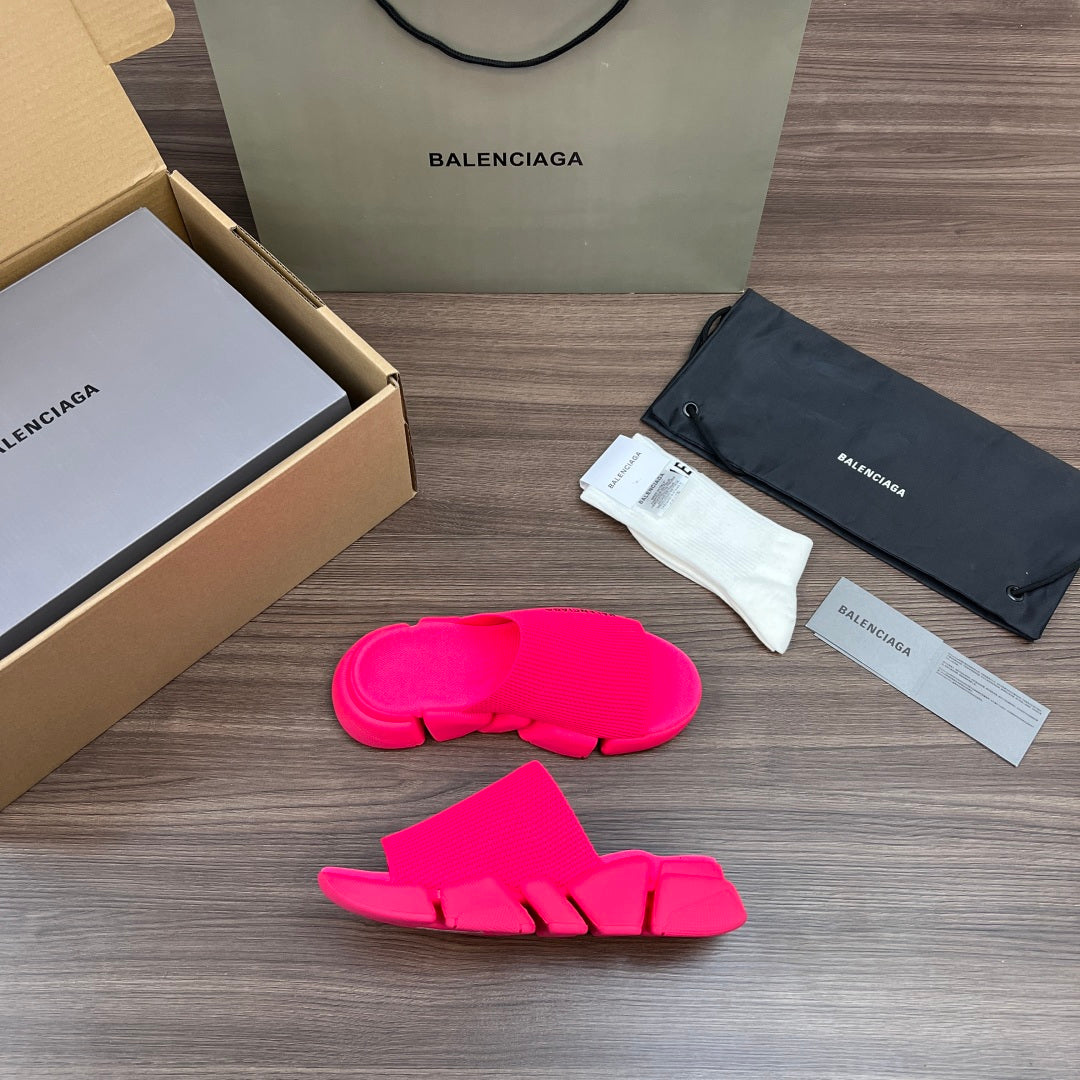 Bright pink Balenciaga slide sandals with three front straps and thick textured sole