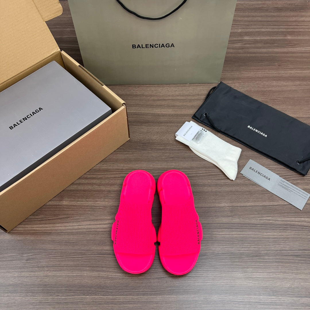 Balenciaga slide sandals in bright pink with three front straps and cushioned footbed
