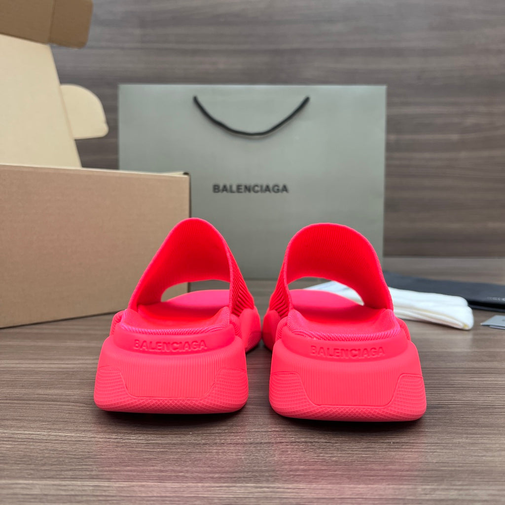 Bright pink Balenciaga slide sandals, back view with heel openings and logo band