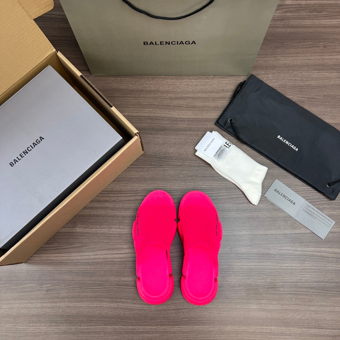 Bright pink Balenciaga slide sandals, front view with three strap details