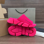 Bright pink Balenciaga slide sandals, top and outsole view with textured tread