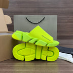 Balenciaga neon green sandals showing outsole tread and molded straps