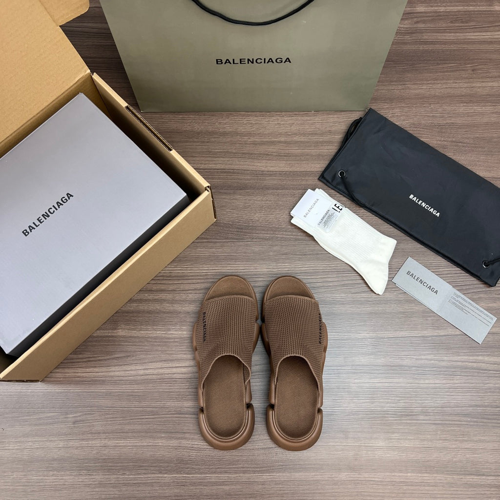 Tan knit sandal pair, front view, with adjustable strap and thick rubber sole