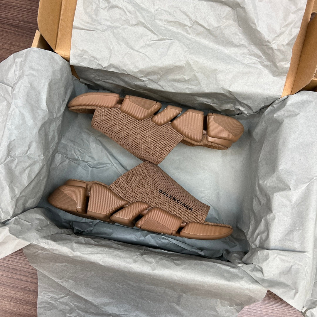 Tan knit slide sandals with multiple straps, showing footbed and sole