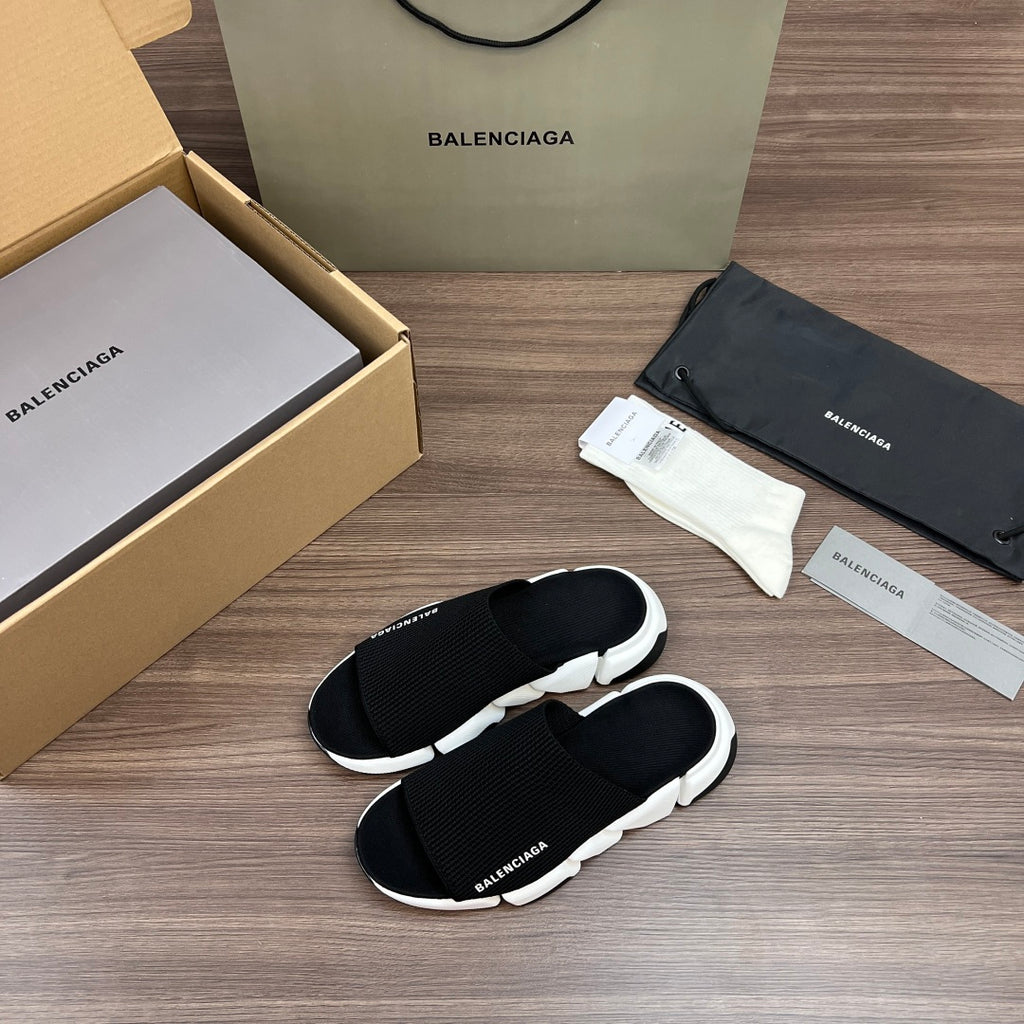 Balenciaga slide sandals with black strap and white platform sole, side view