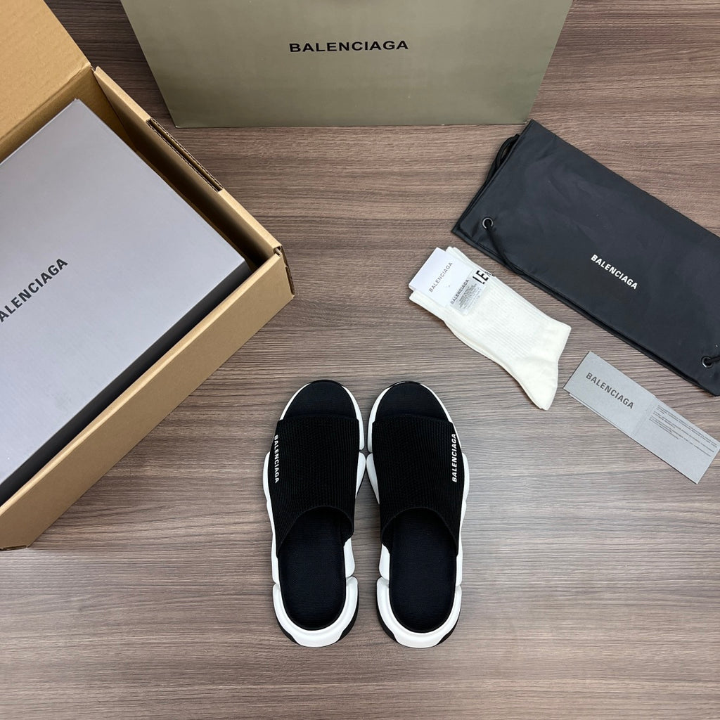 Balenciaga slide sandals, black upper with white platform sole and logo detailing