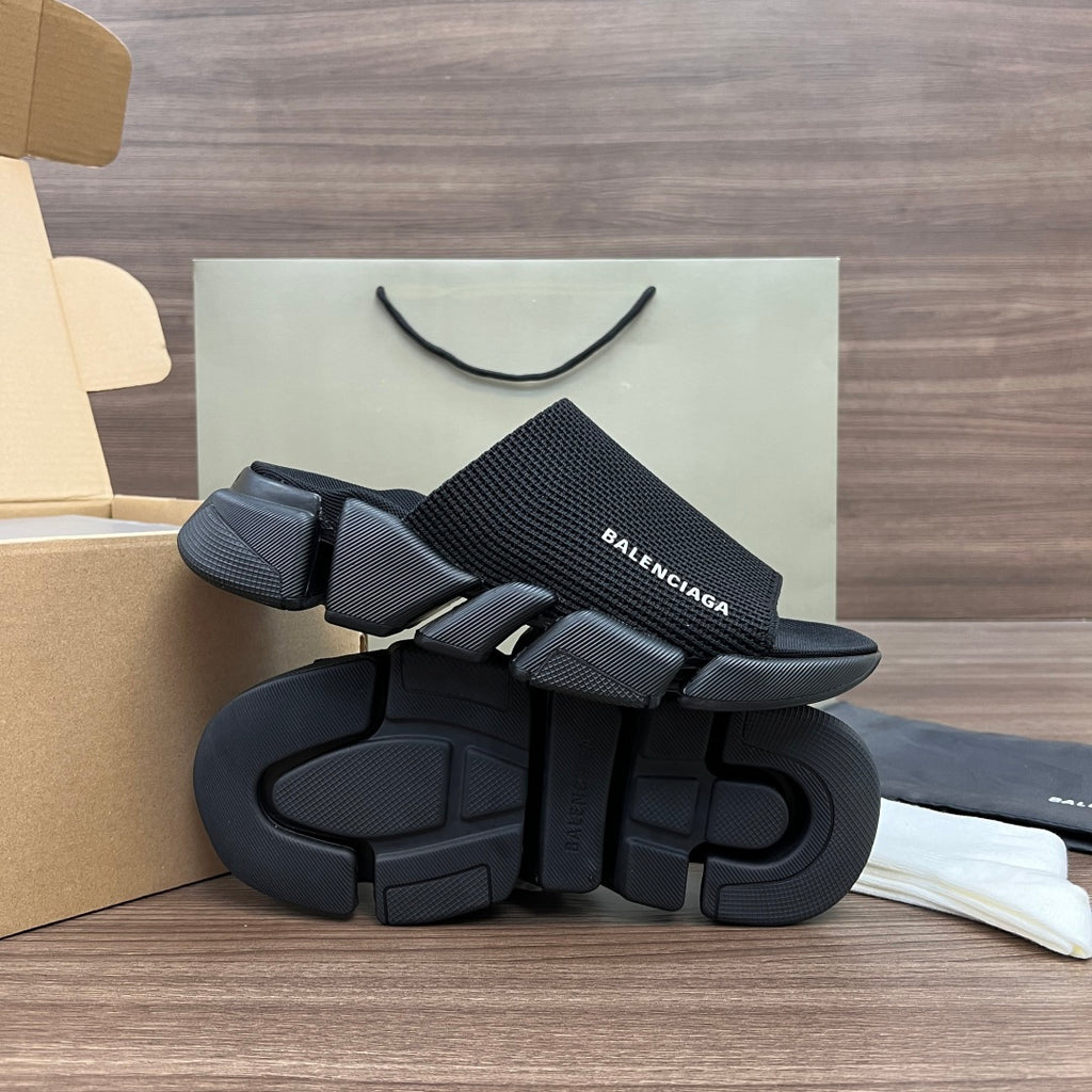 Balenciaga dark slide sandals with thick tread outsole and textured strap