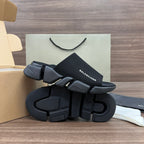 Balenciaga dark slide sandals with thick tread outsole and textured strap