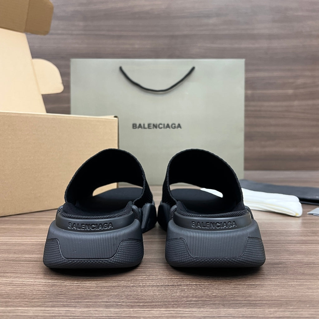 Balenciaga dark slip-on sandals with cushioned heel and molded tread