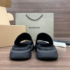 Balenciaga dark slip-on sandals with cushioned heel and molded tread