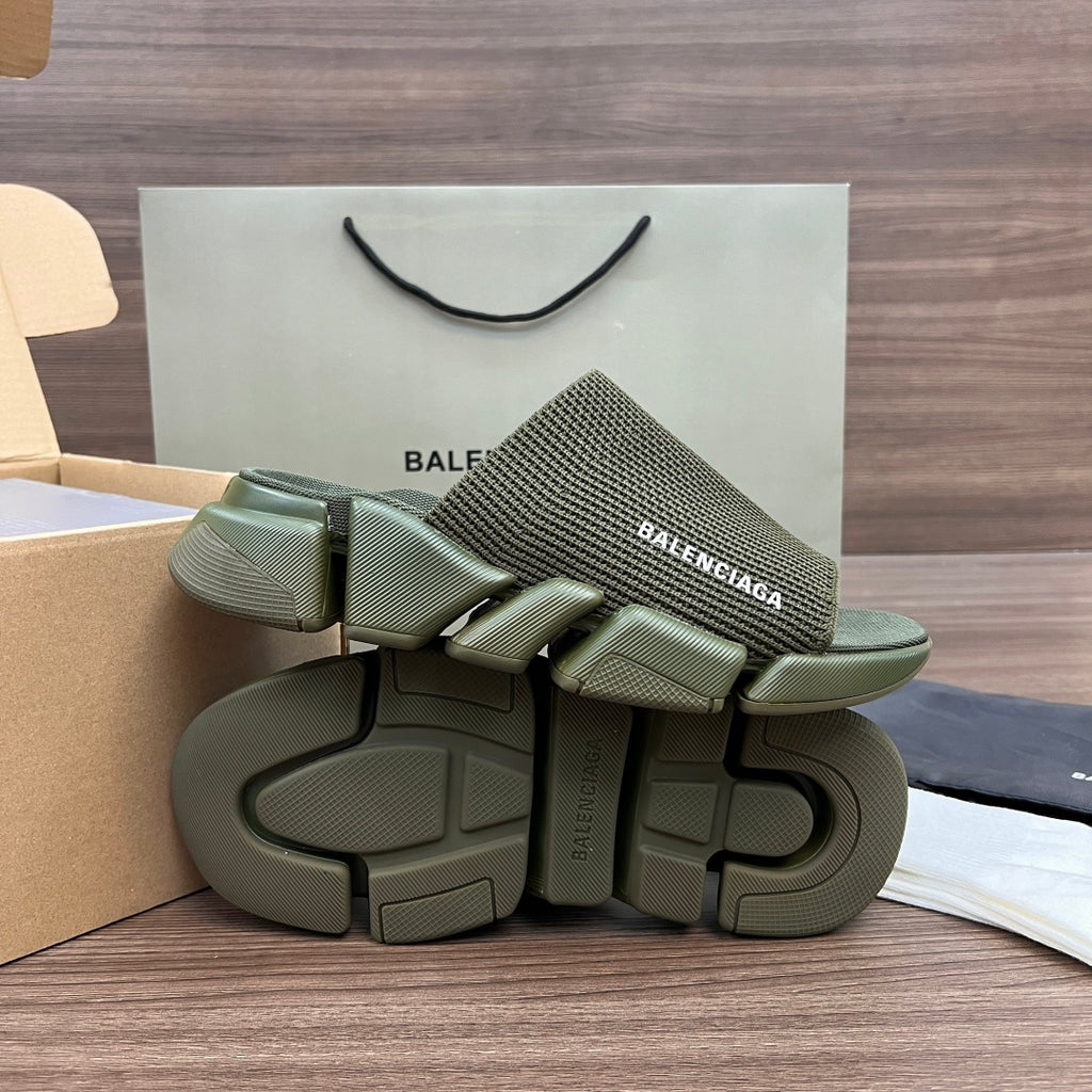 Stacked green knit slide sandals with thick, chunky outsole and strap detail