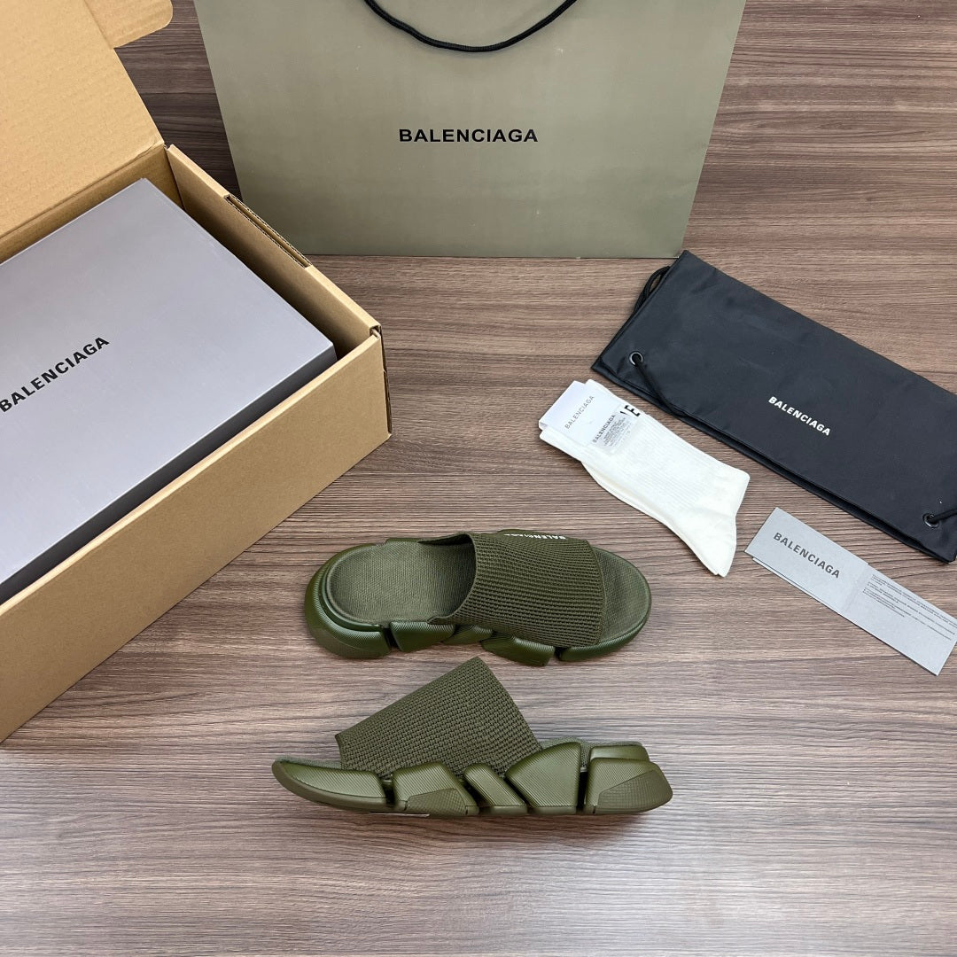 Green knit slide sandals, one pair shown with thick sole and open toe
