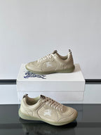 Burberry lace-up sneakers, cream leather with gum rubber sole, side/front angles