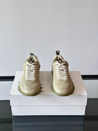 Burberry lace-up sneakers from front, cream leather, lace panels and logo detail