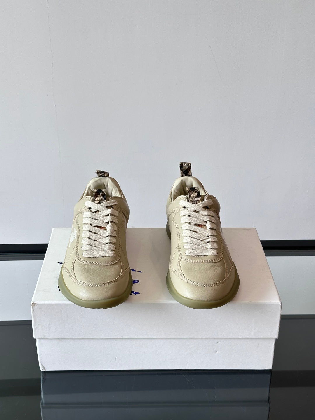 Burberry lace-up sneakers from front, cream leather, lace panels and logo detail