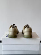 Burberry cream lace-up sneakers, rear view on box with stitched heel details