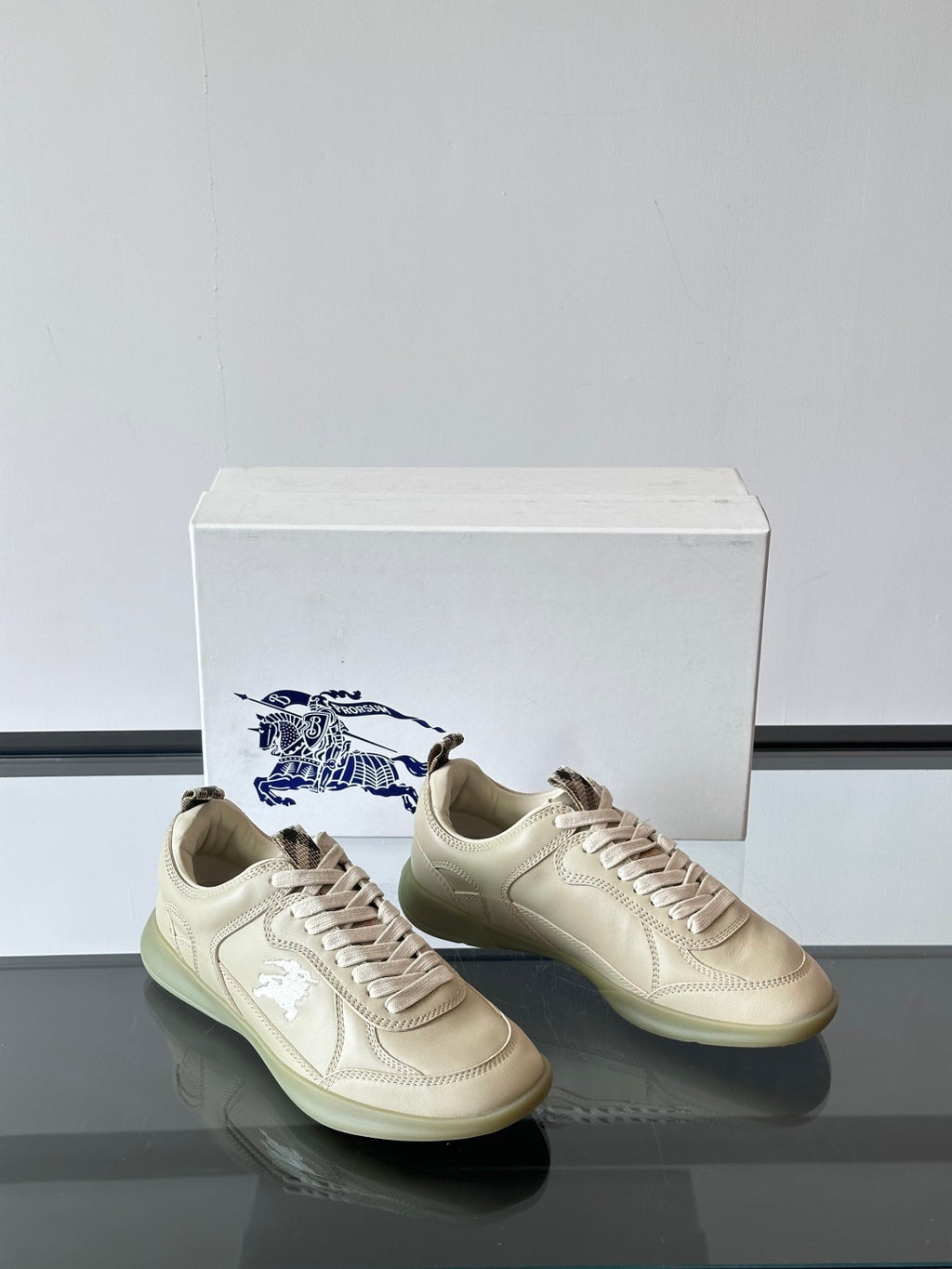 Burberry pair of cream sneakers, lace-up design with light logo patch